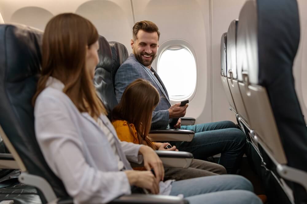 Family sitting together on an airplane