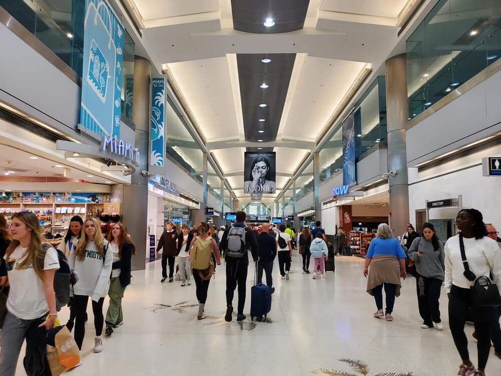 People walking through Miami International Airport
