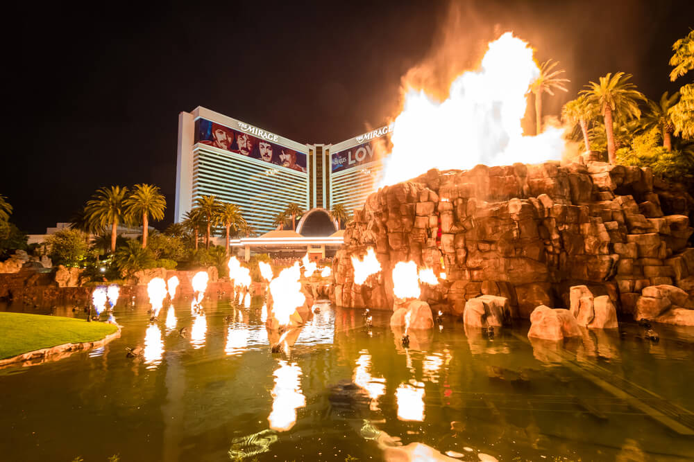 The Mirage's volcano lighting up at night.